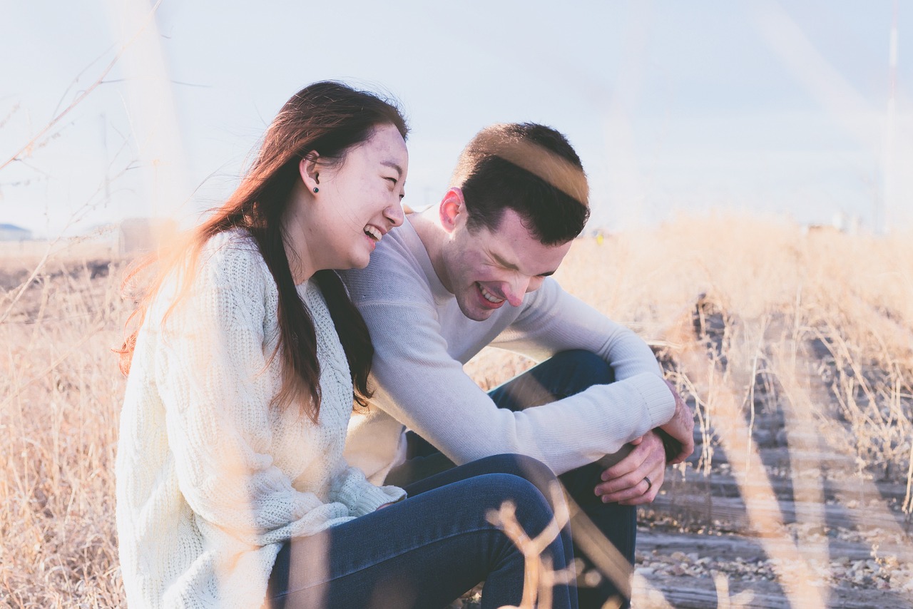 Boy and Girl laughing in corn field